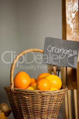 Juicy orange in wicker basket at organic section