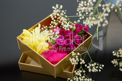 Opened gift box with a flowers