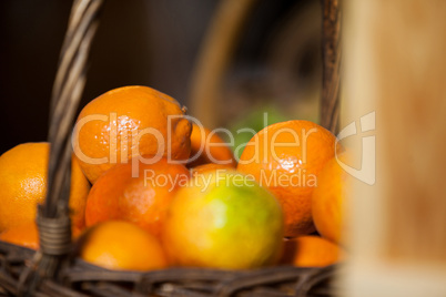 Juicy oranges in wicker basket at organic section