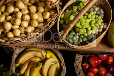 Various fruits and vegetables in wicker basket at organic section