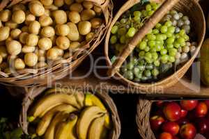 Various fruits and vegetables in wicker basket at organic section