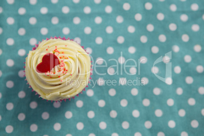 Cupcake against polka dot background
