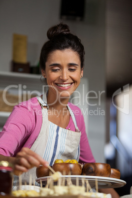 Female staff working at counter in market