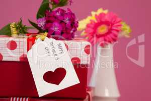 Happy mothers day card and flowers on gift boxes