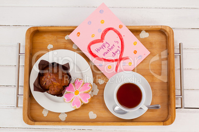 Happy mothers day greeting card with tea and snacks