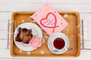 Happy mothers day greeting card with tea and snacks