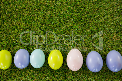Colored Easter egg on grass