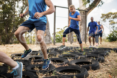 People receiving tire obstacle course training