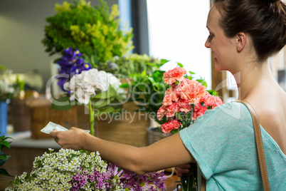 Woman making payment at counter