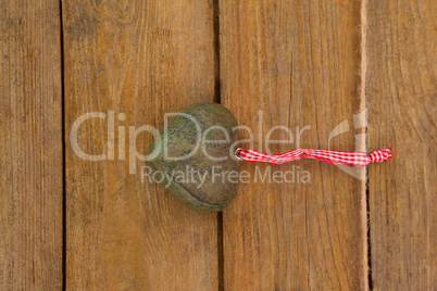 Green textured heart hanging on rope
