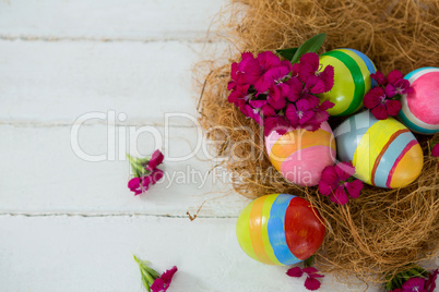 Multicolored Easter eggs in the nest