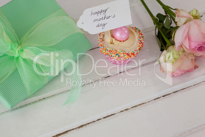 Happy mothers day card with cup cake and gift box