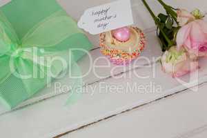 Happy mothers day card with cup cake and gift box