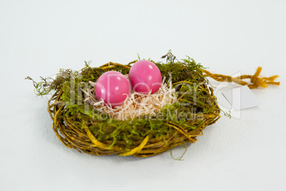 Pink Easter eggs in the nest