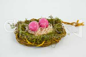 Pink Easter eggs in the nest