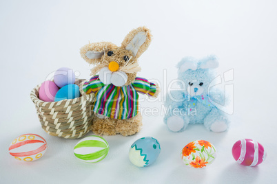 Basket with Easter eggs and toy Easter bunny
