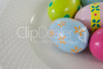 Painted Easter eggs on plate