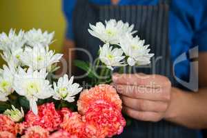 Florist holding flowers in florist shop