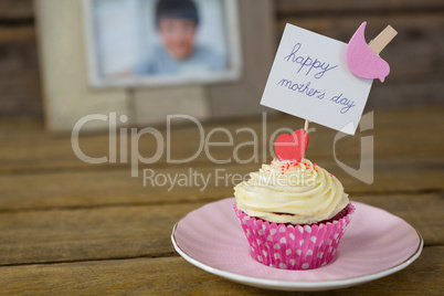 Close-up of delicious cupcake with happy mothers day label