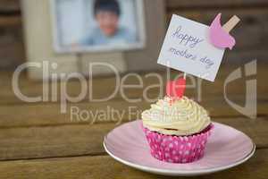 Close-up of delicious cupcake with happy mothers day label