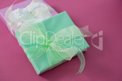 Gift boxes against pink background