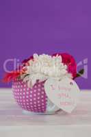 Bunch of fresh flowers with I love you mom card