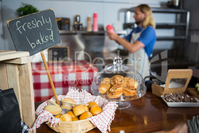 Freshly baked bread in wicker basket at display counter