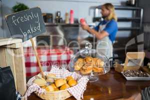 Freshly baked bread in wicker basket at display counter