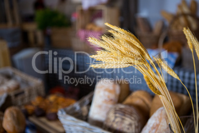 Ears of wheat at counter in bakery shop