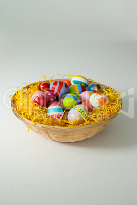 Painted easter eggs in basket