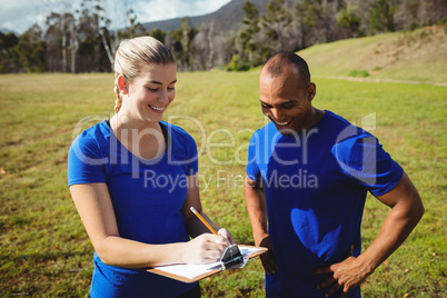 Female trainer instructing a man