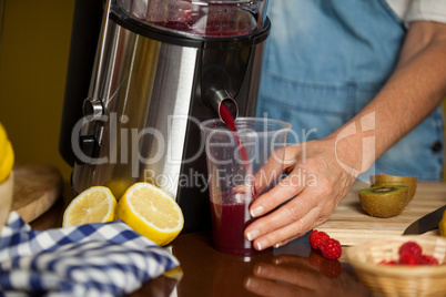 Female staff preparing a juice