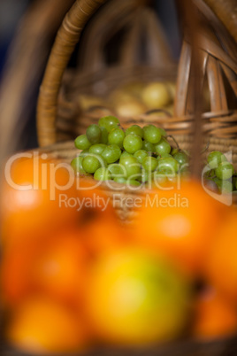 Juicy grapes in wicker basket at organic section