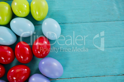 Colorful Easter eggs on wooden surface