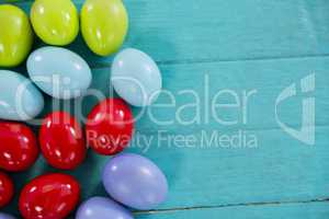 Colorful Easter eggs on wooden surface