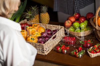 Various types of fruits and vegetables at counter