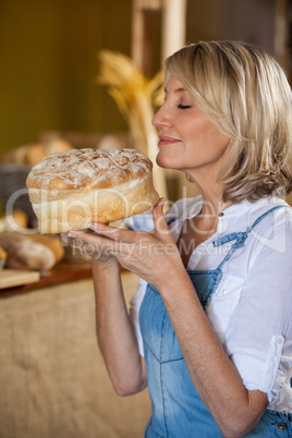 Female staff smelling a sweet food