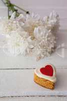 Heart shape easter gingerbread cookie on white table