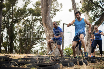 People receiving tire obstacle course training