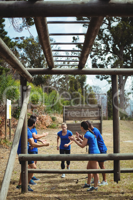 Fit people cheering woman