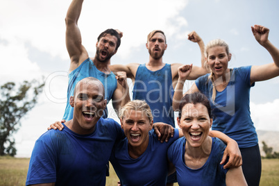 Fit people cheering together