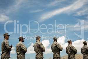 Group of military soldiers standing with rifles