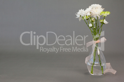 Flower vase tied with ribbon