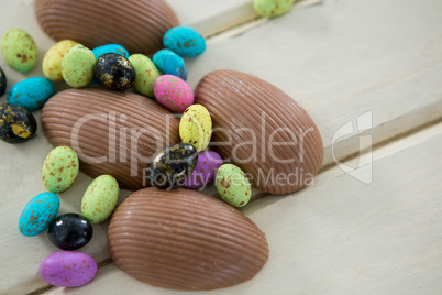 Chocolate Easter eggs on wooden plank