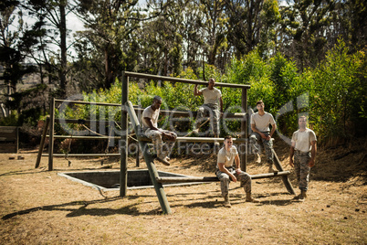 Soldiers sitting on the obstacle course in bootcamp