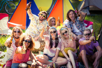 Group of friends having fun together at campsite