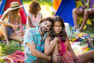 Couple sitting near campsite
