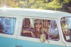 Group of friends travelling in campervan