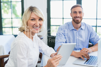 Smiling executives in a restaurant