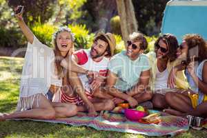 Group of happy friend taking a selfie in park